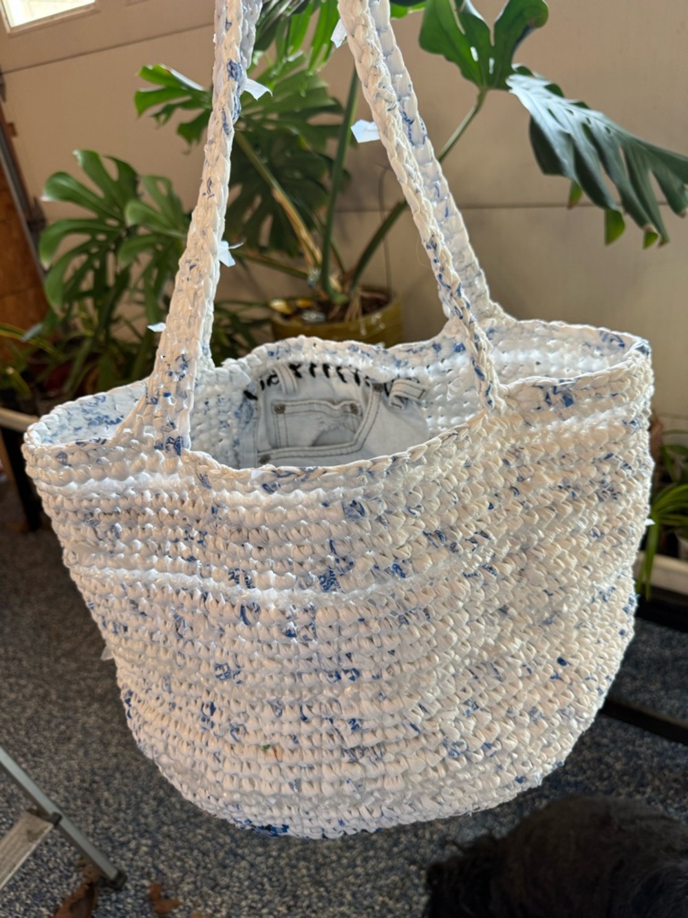 Handmade from plastic bags crocheted shopping tote bag with a pocket